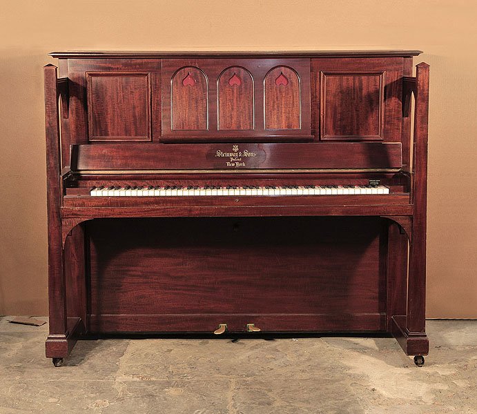 Arts and Crafts style, 1905, Steinway upright piano for sale with a figured, mahogany case and large sculptural legs
