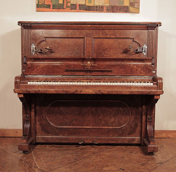 Antique, 1884, Steinway upright piano for sale with a burr walnut case and brass candlesticks